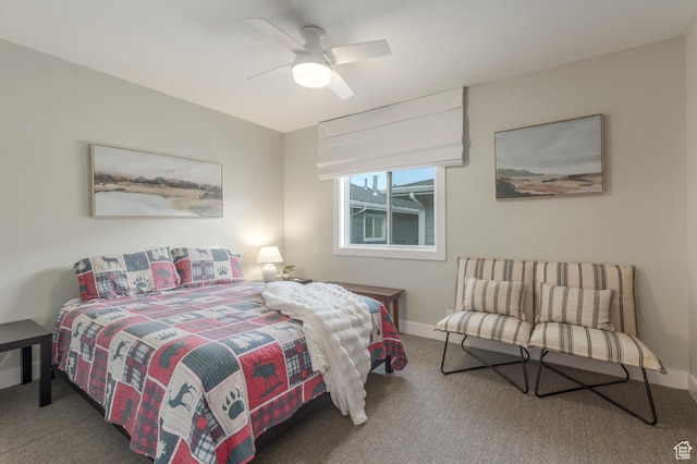 carpeted bedroom featuring a ceiling fan and baseboards