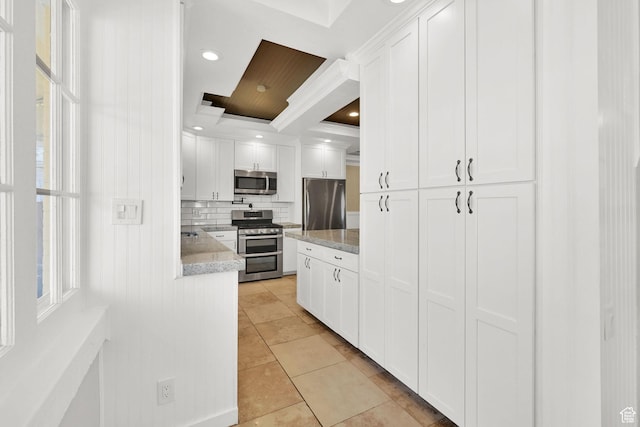 1248 26th St, Ogden, UT 84401 - kitchen with white cabinets, ornamental molding, appliances with stainless steel finishes, and tasteful backsplash