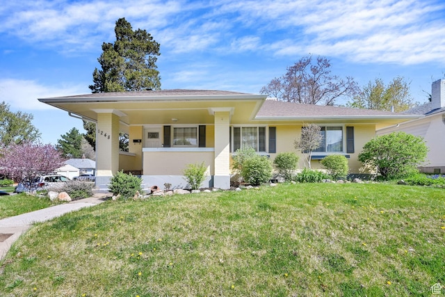 1248 26th St, Ogden, UT 84401 - view of front of property with a shingled roof, brick siding, and a front yard