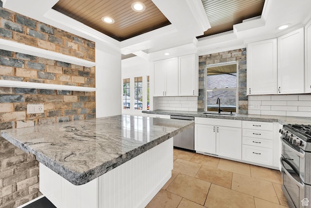 1248 26th St, Ogden, UT 84401 - kitchen featuring a sink, white cabinets, stainless steel appliances, a raised ceiling, and wooden ceiling