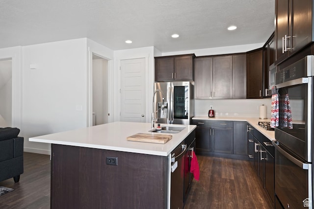 2414 N 4060 W, Lehi, UT 84043 - kitchen featuring dark brown cabinetry, appliances with stainless steel finishes, dark wood-style floors, and light countertops