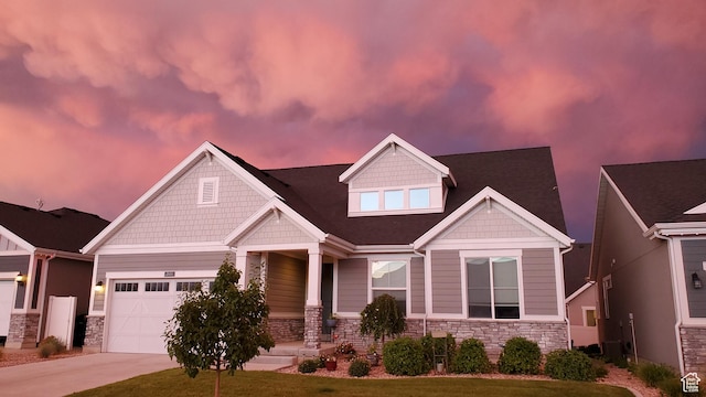 2414 N 4060 W, Lehi, UT 84043 - craftsman-style house with driveway, stone siding, covered porch, and a garage