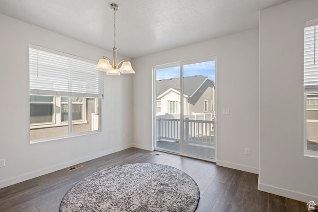 2414 N 4060 W, Lehi, UT 84043 - unfurnished dining area featuring visible vents, baseboards, wood finished floors, and a chandelier
