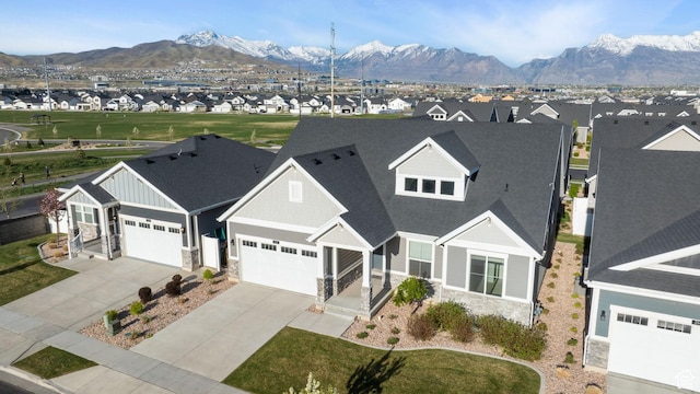 2414 N 4060 W, Lehi, UT 84043 - view of front of property featuring board and batten siding, driveway, stone siding, roof with shingles, and a garage