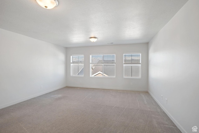 2414 N 4060 W, Lehi, UT 84043 - empty room with light carpet, baseboards, and a textured ceiling