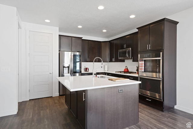 2414 N 4060 W, Lehi, UT 84043 - kitchen featuring dark brown cabinets, stainless steel appliances, dark wood-style floors, and a sink
