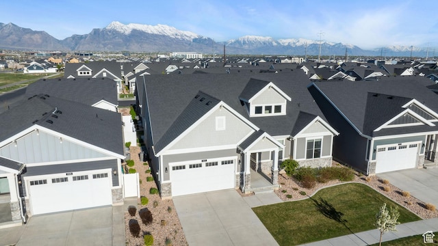2414 N 4060 W, Lehi, UT 84043 - view of front of house with driveway, stone siding, board and batten siding, a mountain view, and a residential view