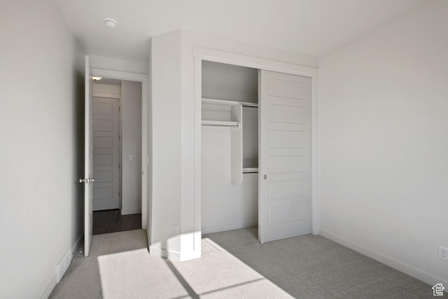 2414 N 4060 W, Lehi, UT 84043 - unfurnished bedroom featuring baseboards, a closet, and light colored carpet