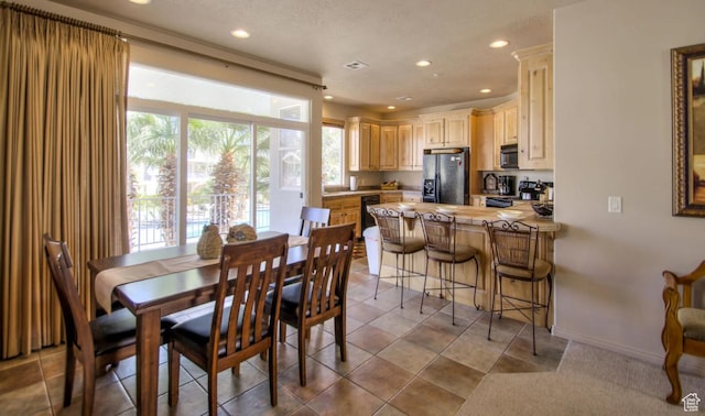 dining area with baseboards and recessed lighting