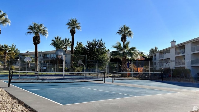 view of sport court with fence and community basketball court
