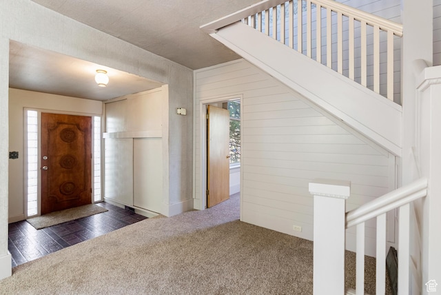 382 N 400 E, Logan, UT 84321 - entrance foyer featuring carpet floors, wood walls, stairs, and plenty of natural light