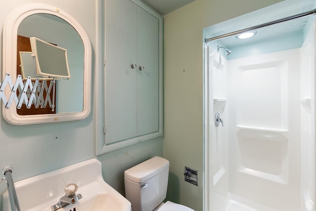 382 N 400 E, Logan, UT 84321 - full bathroom featuring a shower stall, toilet, and a sink