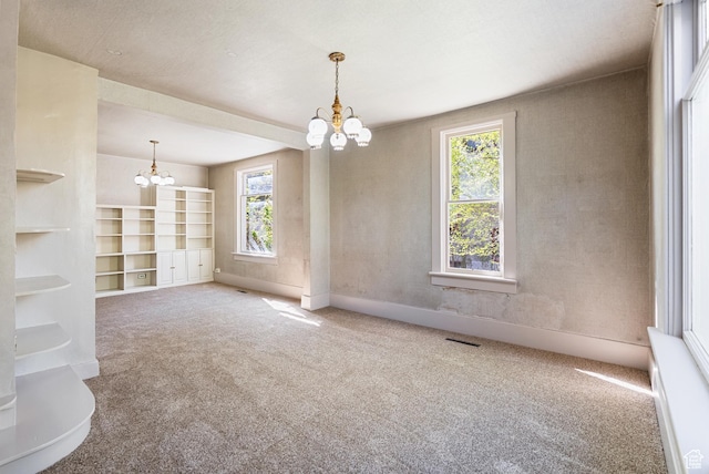 382 N 400 E, Logan, UT 84321 - unfurnished room with a chandelier, plenty of natural light, carpet floors, and visible vents