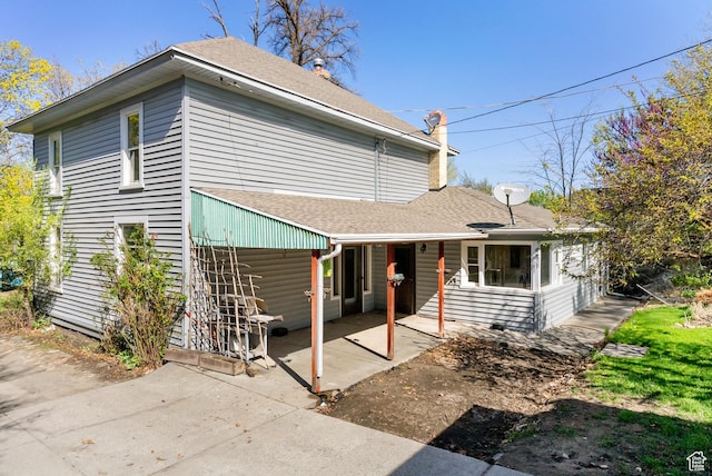 382 N 400 E, Logan, UT 84321 - back of house with a patio area, roof with shingles, and a carport