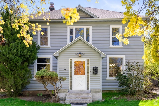 382 N 400 E, Logan, UT 84321 - view of front of home with a shingled roof and a chimney