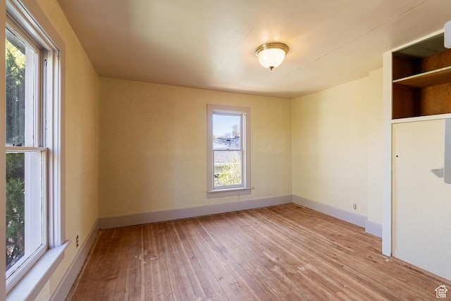 382 N 400 E, Logan, UT 84321 - spare room with baseboards, a healthy amount of sunlight, and wood-type flooring
