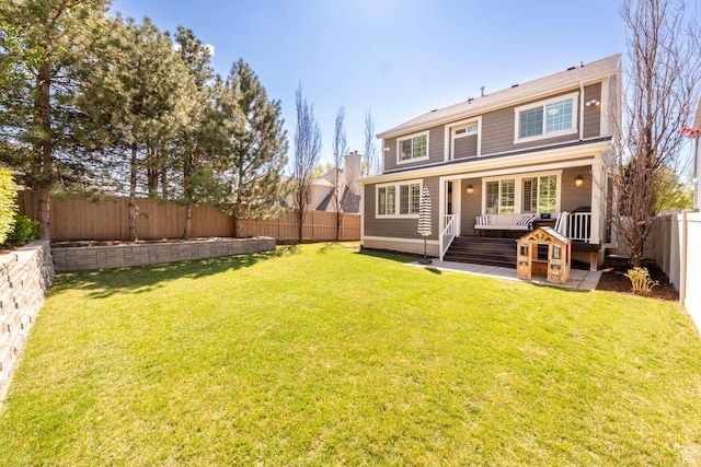 back of property featuring a fenced backyard, an outdoor living space, and a lawn