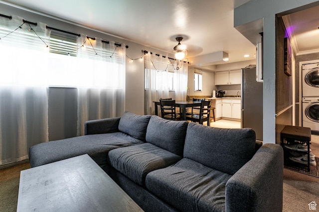 2220 E Murray Holladay Rd S Unit 128, Salt Lake City, UT 84117 - carpeted living room featuring stacked washer / dryer