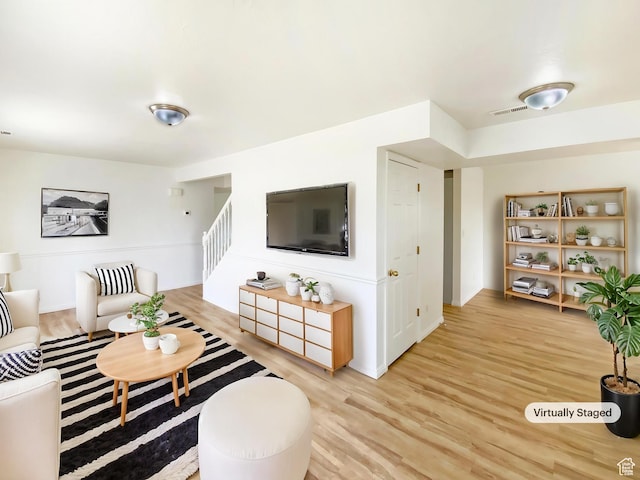 654 W 100 N, Spanish Fork, UT 84660 - living room with light wood-style floors, stairway, visible vents, and baseboards