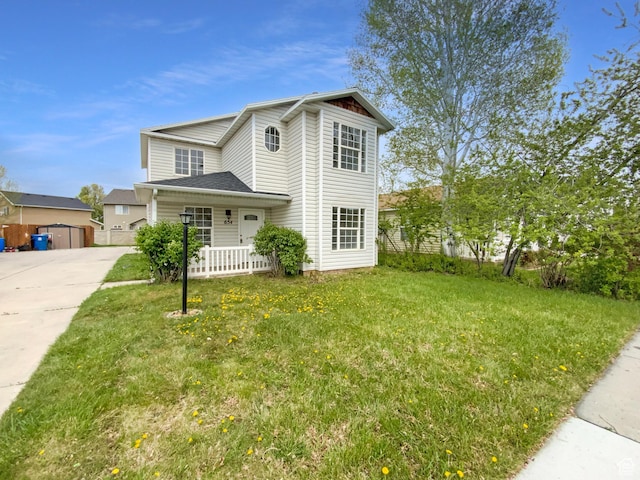 traditional-style home with a porch and a front lawn