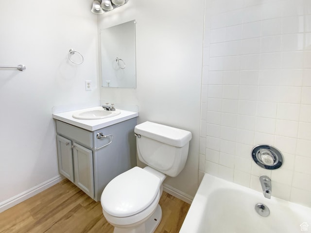 654 W 100 N, Spanish Fork, UT 84660 - bathroom featuring toilet, shower / bathtub combination, baseboards, wood finished floors, and vanity