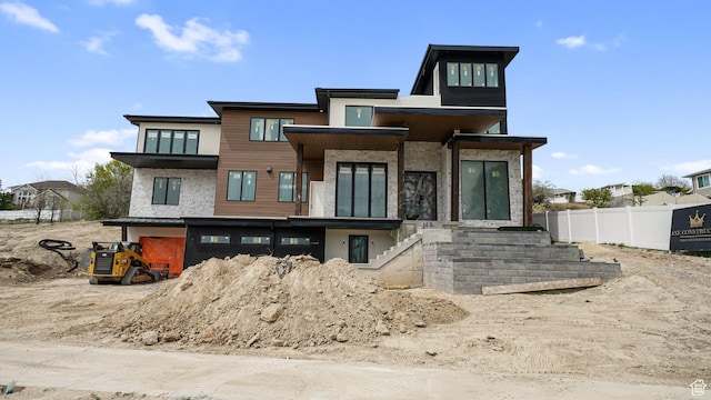 11606 S Halcom Dr, South Jordan, UT 84095 - view of front facade featuring fence, stairway, and stucco siding
