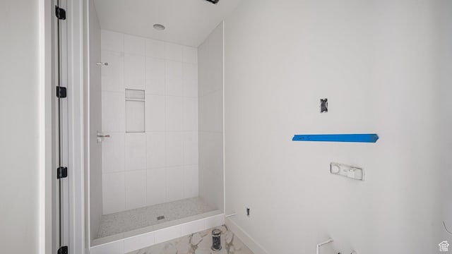 11606 S Halcom Dr, South Jordan, UT 84095 - bathroom with tiled shower, baseboards, and marble finish floors