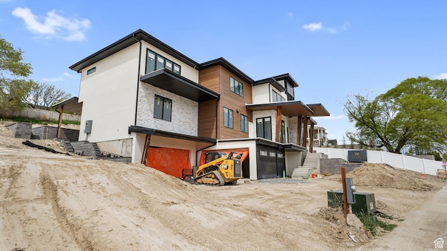 11606 S Halcom Dr, South Jordan, UT 84095 - view of front of home with an attached garage, stucco siding, and fence