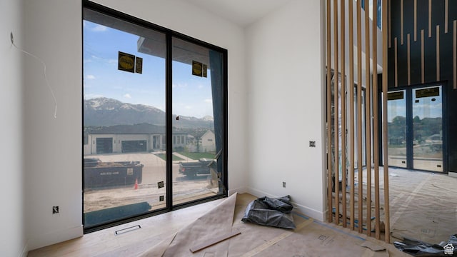 11606 S Halcom Dr, South Jordan, UT 84095 - spare room with plenty of natural light, a mountain view, and baseboards
