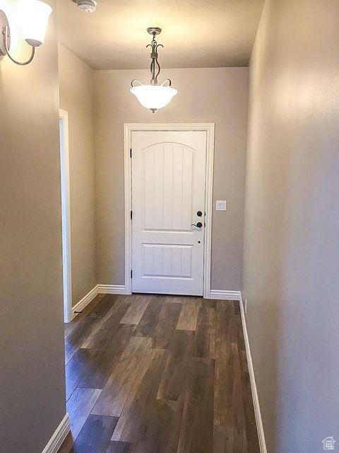 232 W 200 S, Ivins, UT 84738 - doorway featuring dark wood finished floors and baseboards