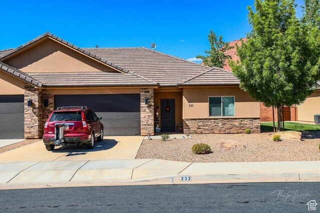 232 W 200 S, Ivins, UT 84738 - ranch-style home featuring stone siding, a tile roof, a garage, and stucco siding