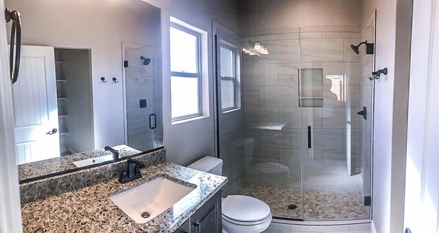 232 W 200 S, Ivins, UT 84738 - bathroom with vanity, a shower stall, and toilet