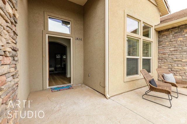 1426 S 535 E, Washington, UT 84780 - entrance to property with stone siding, a patio, and stucco siding