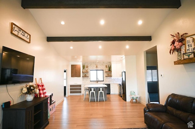 2167 S 560 W, Roosevelt, UT 84066 - living room featuring baseboards, light wood-style floors, vaulted ceiling with beams, and recessed lighting