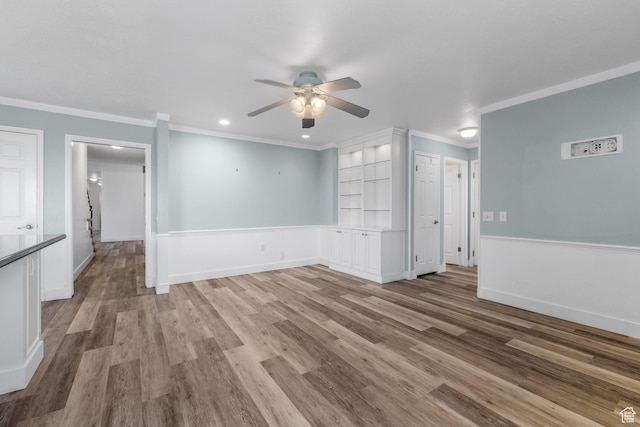 unfurnished living room with recessed lighting, light wood-style flooring, crown molding, and ceiling fan