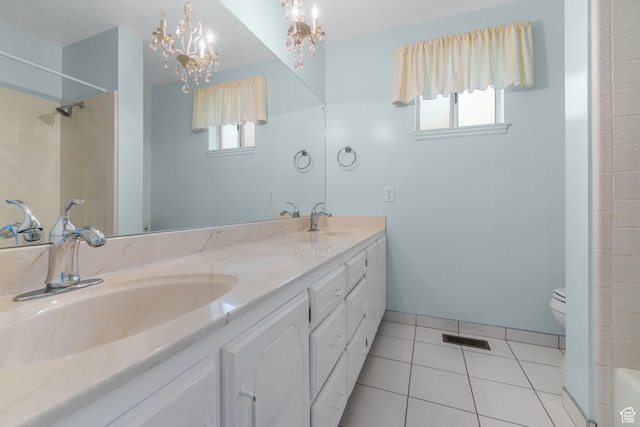 bathroom with a sink, visible vents, and plenty of natural light