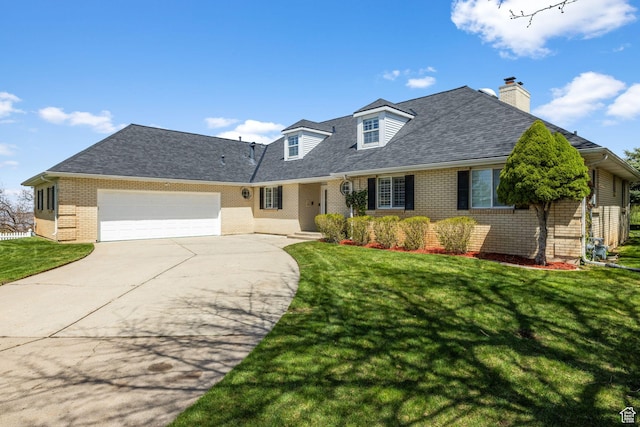 view of front of home featuring a chimney, a front lawn, driveway, brick siding, and a garage