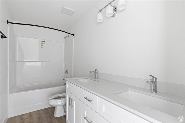 805 S 800 W Unit A, Salt Lake City, UT 84104 - bathroom featuring toilet, washtub / shower combination, wood finished floors, and a sink