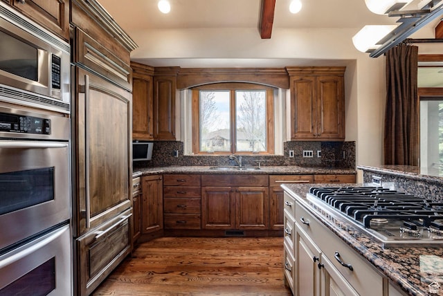 3143 E Bavarian Ct, Cottonwood Heights, UT 84093 - kitchen featuring tasteful backsplash, built in appliances, wood finished floors, and a sink
