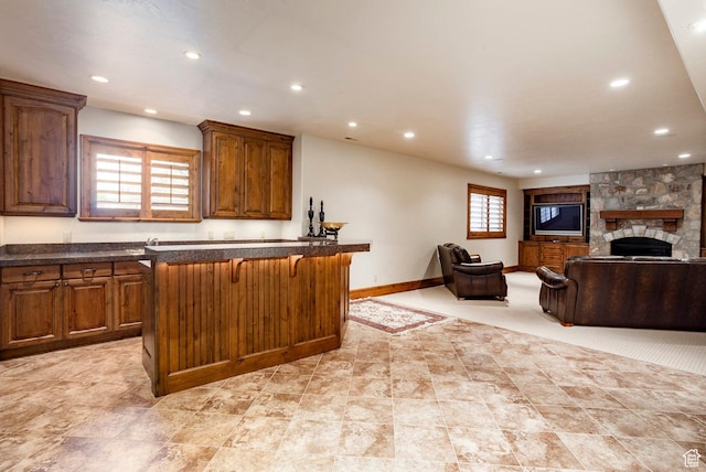 3143 E Bavarian Ct, Cottonwood Heights, UT 84093 - kitchen with dark countertops, recessed lighting, and a breakfast bar area