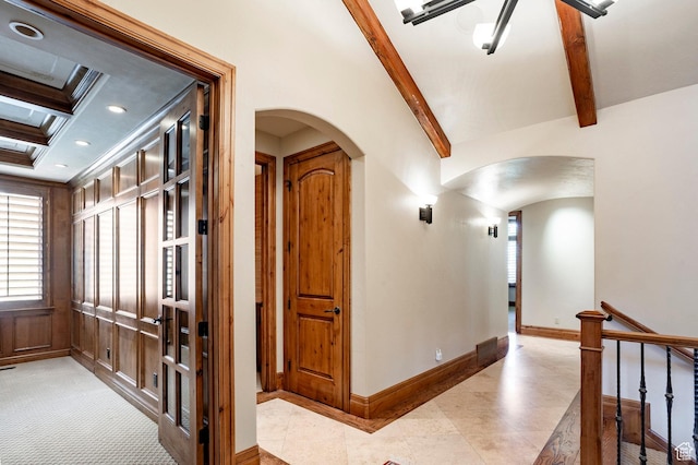 3143 E Bavarian Ct, Cottonwood Heights, UT 84093 - hallway with baseboards, arched walkways, beam ceiling, and light tile patterned floors