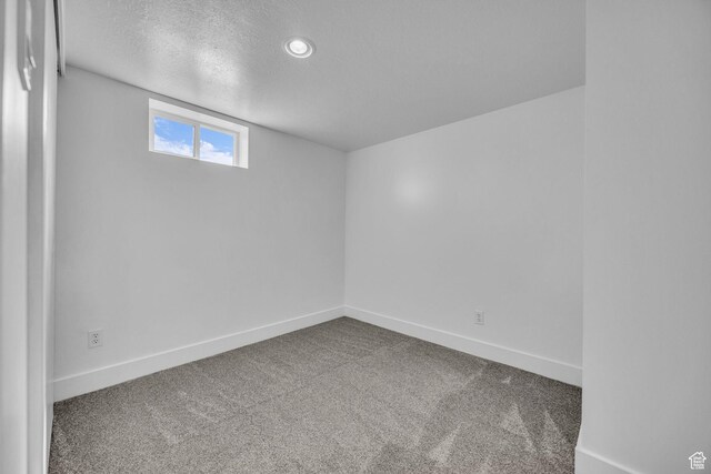 181 E 4300 S, Washington Terrace, UT 84405 - spare room with baseboards, carpet flooring, and a textured ceiling