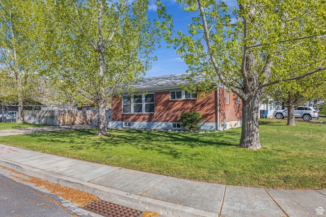 181 E 4300 S, Washington Terrace, UT 84405 - view of front facade with fence, a front lawn, and brick siding