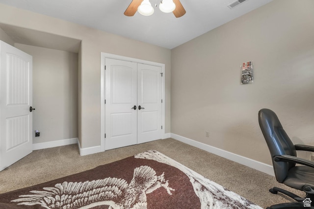office with baseboards, a ceiling fan, and carpet