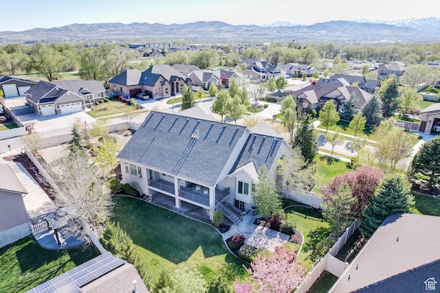 aerial view featuring a mountain view and a residential view