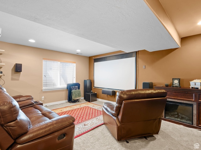 1184 S 1850 E, Spanish Fork, UT 84660 - carpeted cinema room featuring a glass covered fireplace, baseboards, and recessed lighting