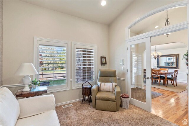 2010 E Rocklin Dr, Sandy, UT 84092 - sitting room with recessed lighting, an inviting chandelier, wood finished floors, visible vents, and baseboards