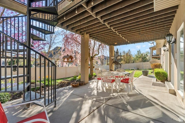 2010 E Rocklin Dr, Sandy, UT 84092 - view of patio / terrace with a fenced backyard, stairs, and outdoor dining space