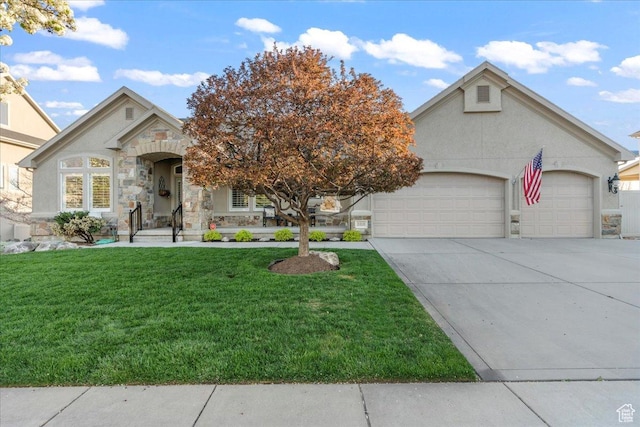 2010 E Rocklin Dr, Sandy, UT 84092 - view of front of property featuring a garage, stone siding, a front lawn, and stucco siding