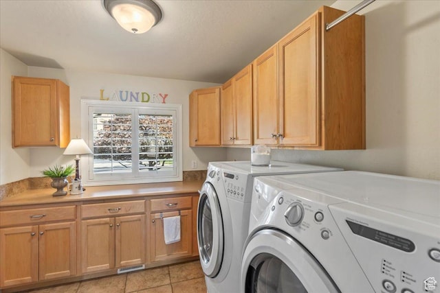 2010 E Rocklin Dr, Sandy, UT 84092 - laundry room featuring washing machine and dryer, cabinet space, light tile patterned flooring, and visible vents